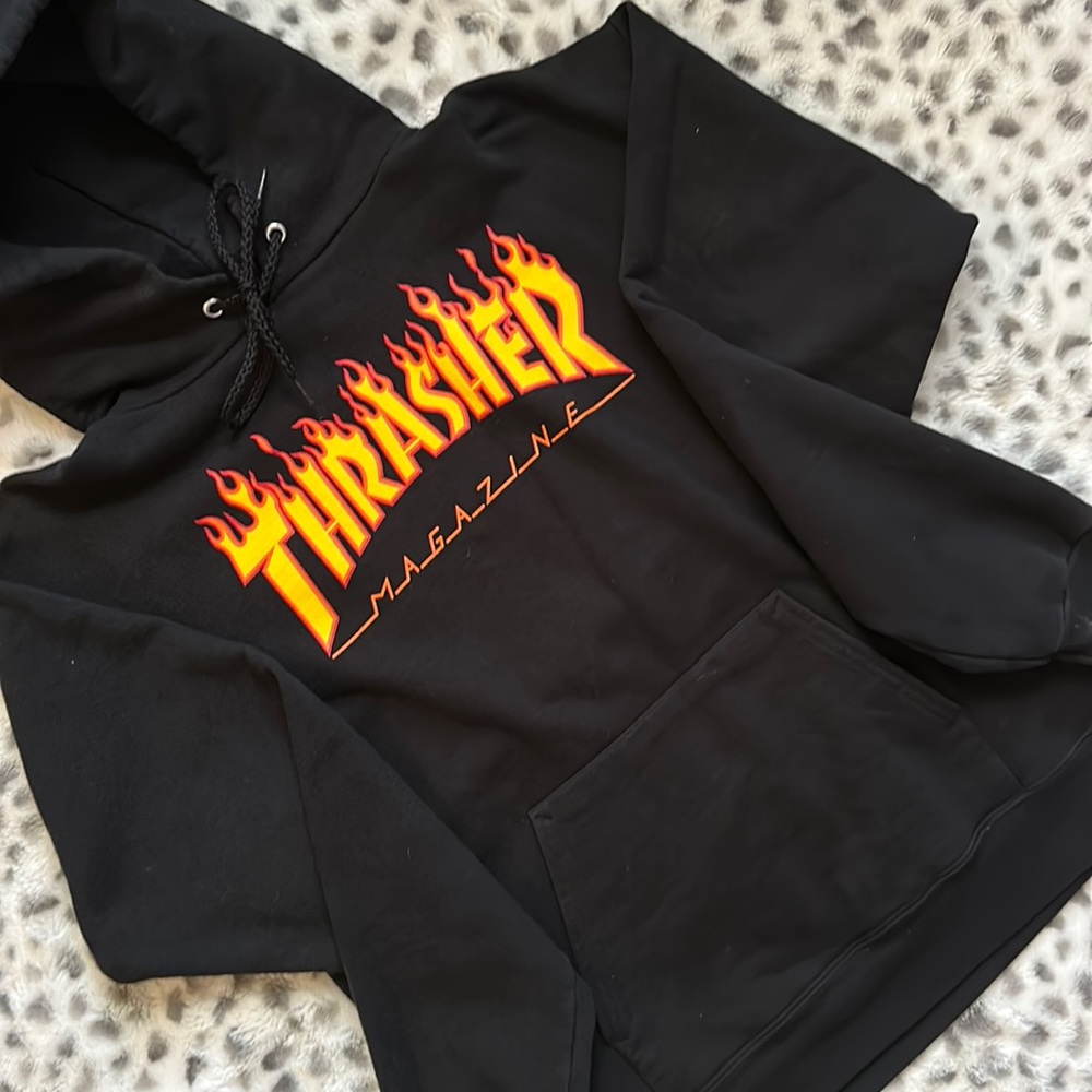 This is a black thrasher, magazine, hoodie, size small